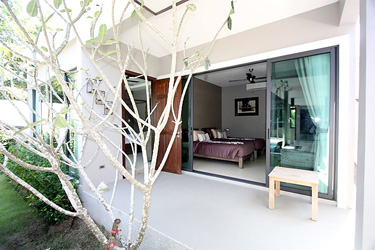 Second Bedroom, and Terrace with Garden and Pool View